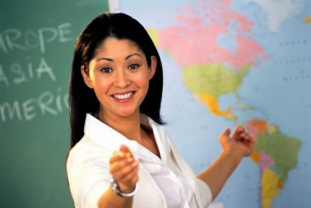 Enthusiastic teacher pointing to map